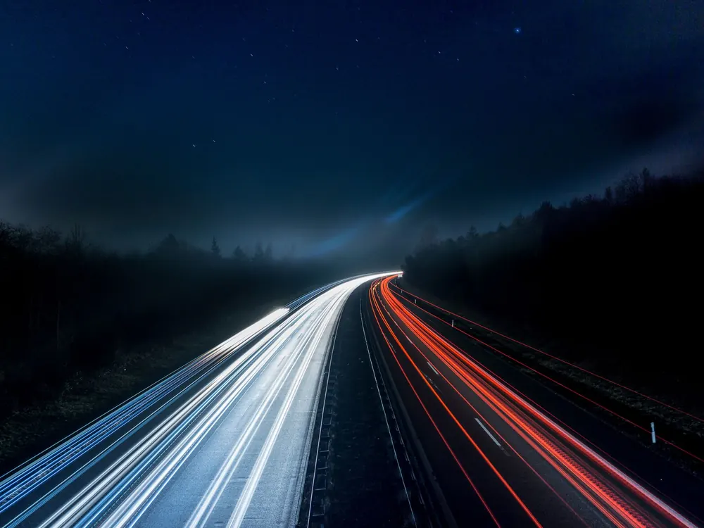 Light trails from traffic on a motorway at night
